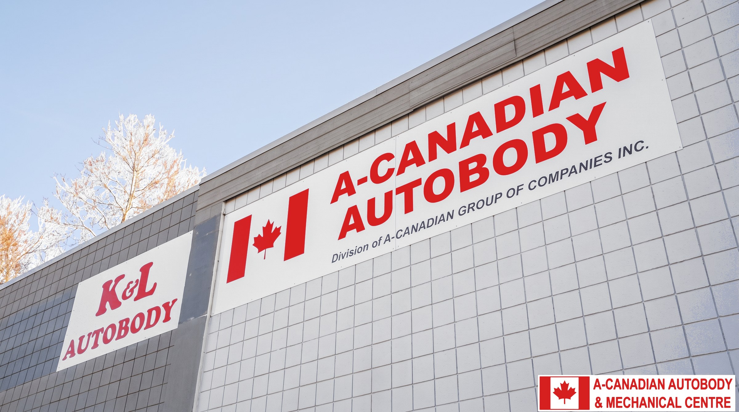 The A-Canadian Autobody sign, red letters and a Canadian flag, on the shop's tiled wall